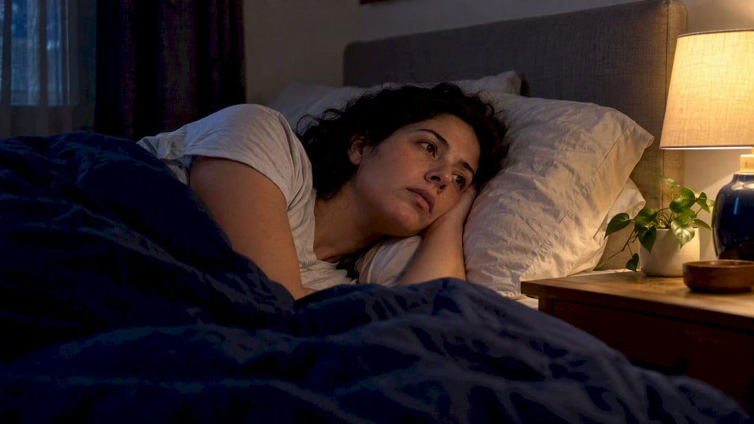 Woman awake in bed at night